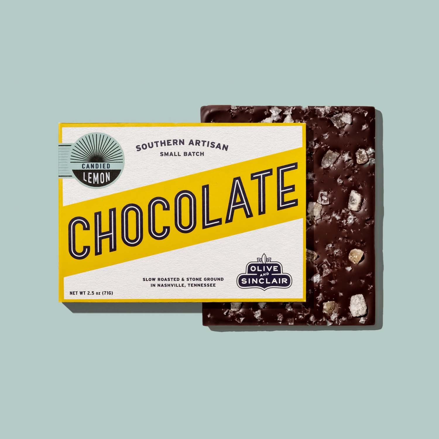 Chocolate bar with a yellow and white label on a light blue background