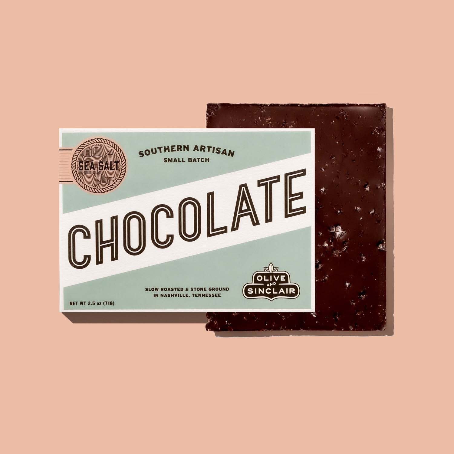Bar of Sea Salt  chocolate with a label on a pink background