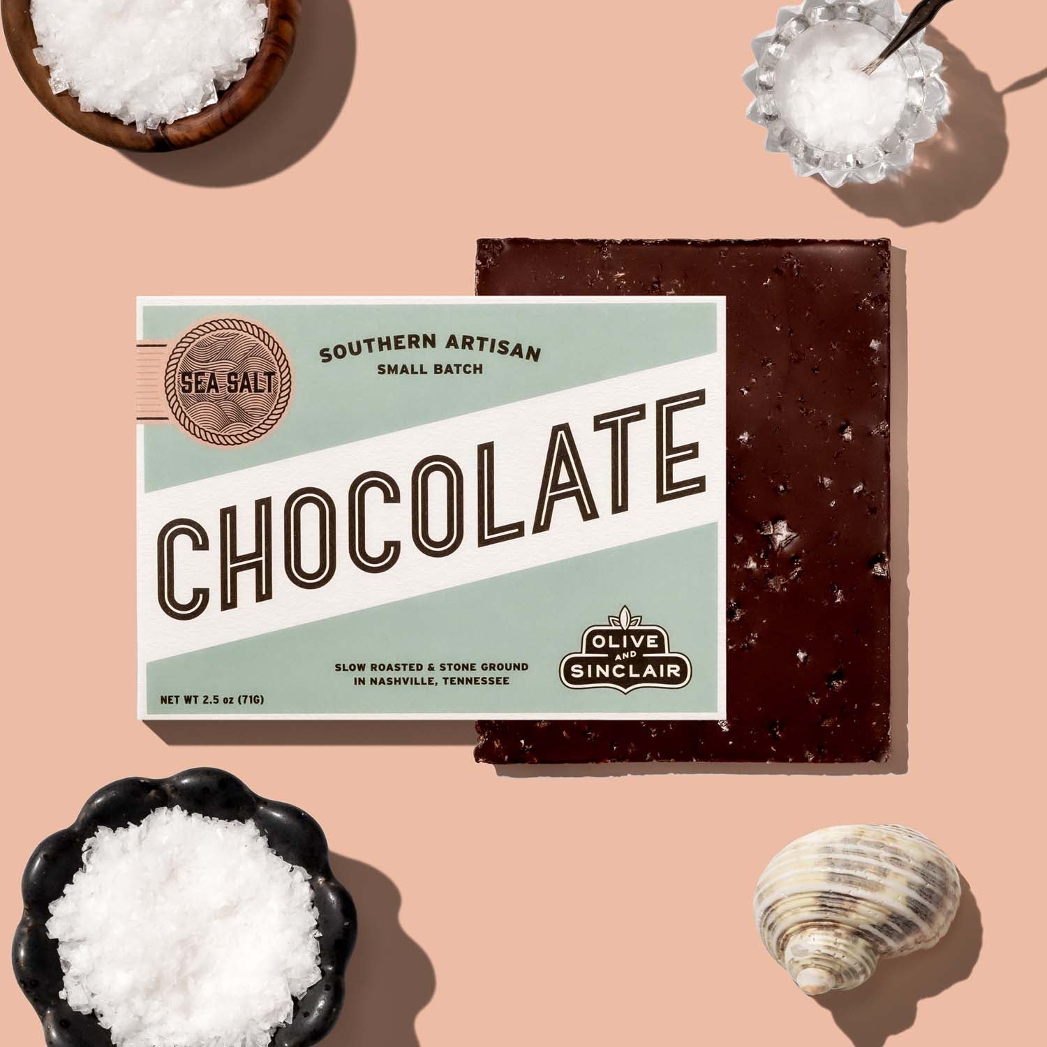 Olive and Sinclair Sea Salt chocolate with Sea Salt in the background 
