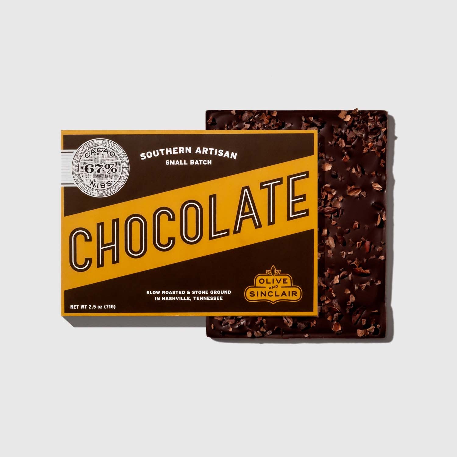Box of Olive Sinclair cacao nibs  chocolate with a visible brand logo on a light gray background