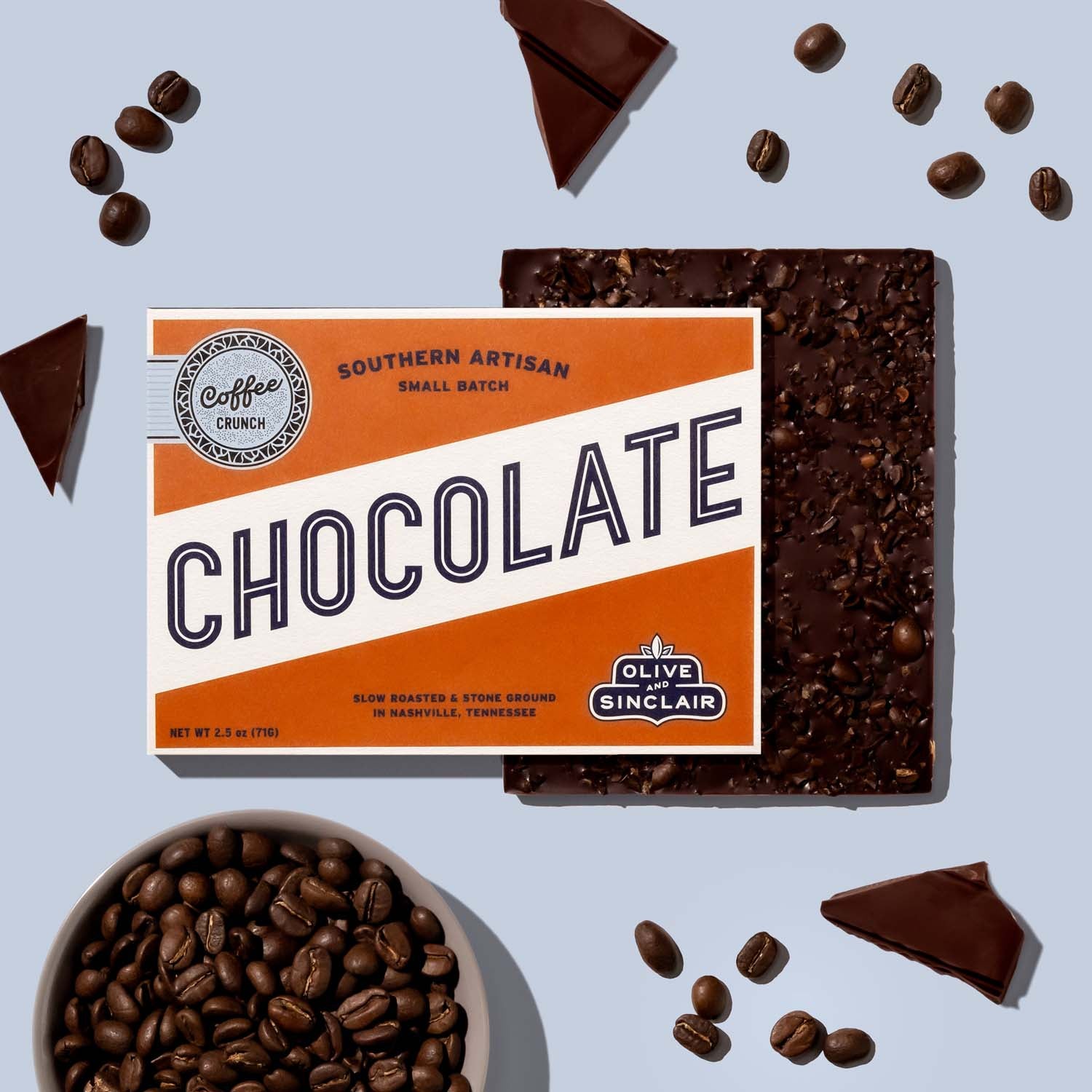 Bar of Coffee Crunch chcolate with coffee beans in the background